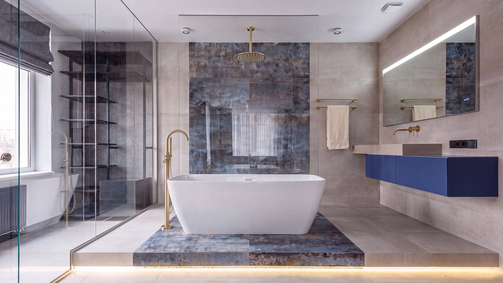 A FERON bathroom with brushed brass tapware and a freestanding bath